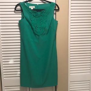 Green dress with embroidered neckline , sleeveless